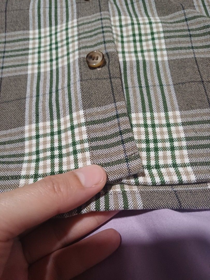 Intique Green Brown Plaid Button Up Blouse Top (Category: Blouses) located in San Juan City. Submitted by marie_d_r (Listing ID 1466251634, Image 3). Description: - Brand: Intique - Pattern: Green and brown plaid - Neckline: V-neck with front brown buttons - Sleeves: Long sleeves with adjustable tie-string cuffs - Fit: Lightweight and comfortable fabric - Condition: Excellent pre-loved condition (ready to wear!).