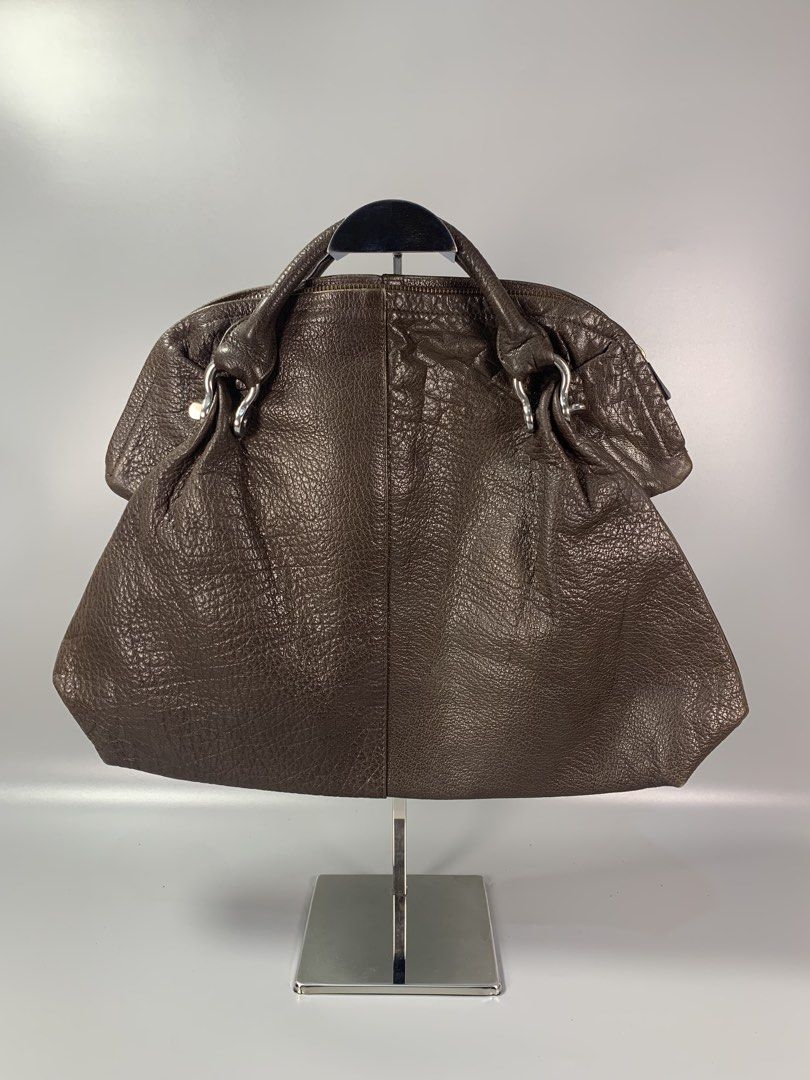 Issey Mikaye Accessory Leather handbag (Category: Belt bags, Clutches and Pouches) located in Mabalacat. Submitted by vtgmalan (Listing ID 1466301818, Image 2). Description: Brand :Issey Miyake Accessory Leather HandBag Price: 7.800 Condition : Excellent Condition Product Condition Rank : AB Issue/s : Minor rubs Dimensions : 17 x 12 x 5 (LxHxW) Inclusions: Shipping Fee Shoulder By Buyer Note : Please make sure to check all the photos before mine.