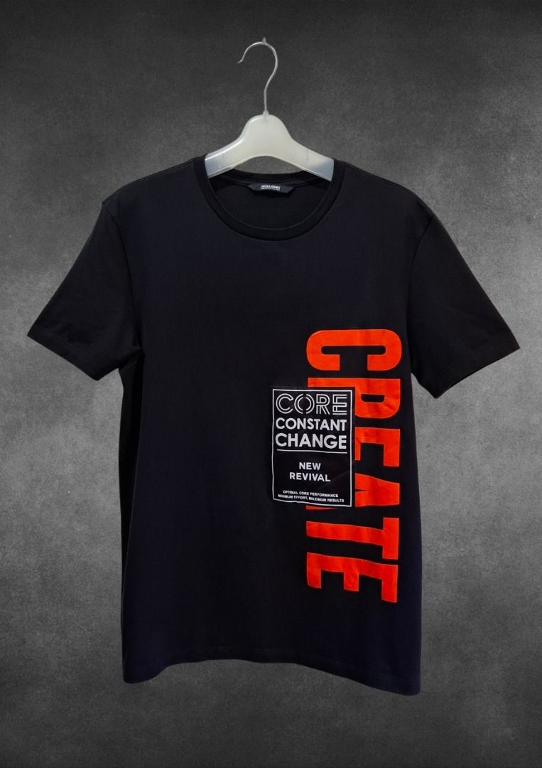 Jack & Jones Core Constant Change T-Shirt Black M (Category: Tshirts & Polo Shirts ) located in Bulacan. Submitted by kei.collections (Listing ID 1466302926, Image 1). Description: - Brand: Jack & Jones - Size: Medium (Regular Fit) - Color: Black with bold orange 'CREATE' text print and graphic box patch - Color Rate: 10/10 - Material: 100% soft and breathable cotton - Design: Clean solid back - Care: Machine washable - Condition: 10/10 - Issue: 