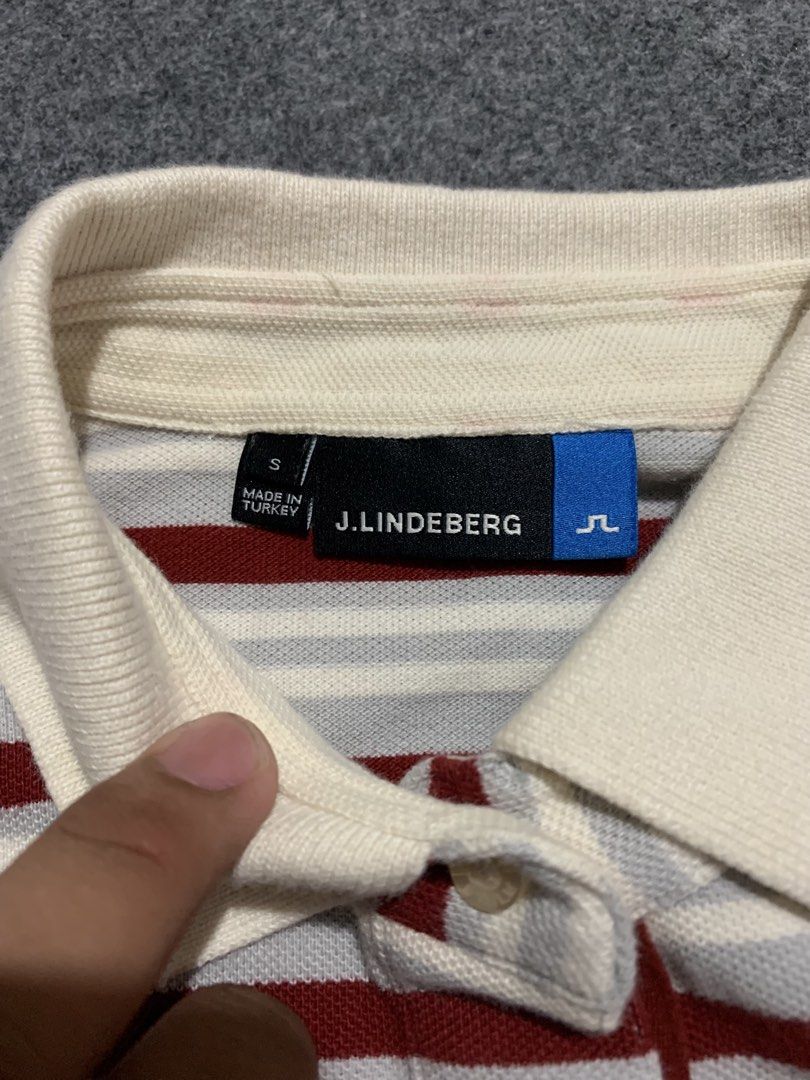 j.lindeberg Patsy 2.0 Field Stripe Polo Shirt (Category: Tshirts & Polo Shirts ) located in Cebu City. Submitted by ninyothrift (Listing ID 1466304901, Image 3). Description: - Brand: J.Lindeberg (Patsy 2.0 Field Stripe) - Size: S - Material: 100% Cotton, Made in Turkey - Design: Red, white, and grey horizontal stripes with contrasting white collar and 3-button placket - Branding: Small embroidered bridge logo on the chest - Condition: Excellent,
