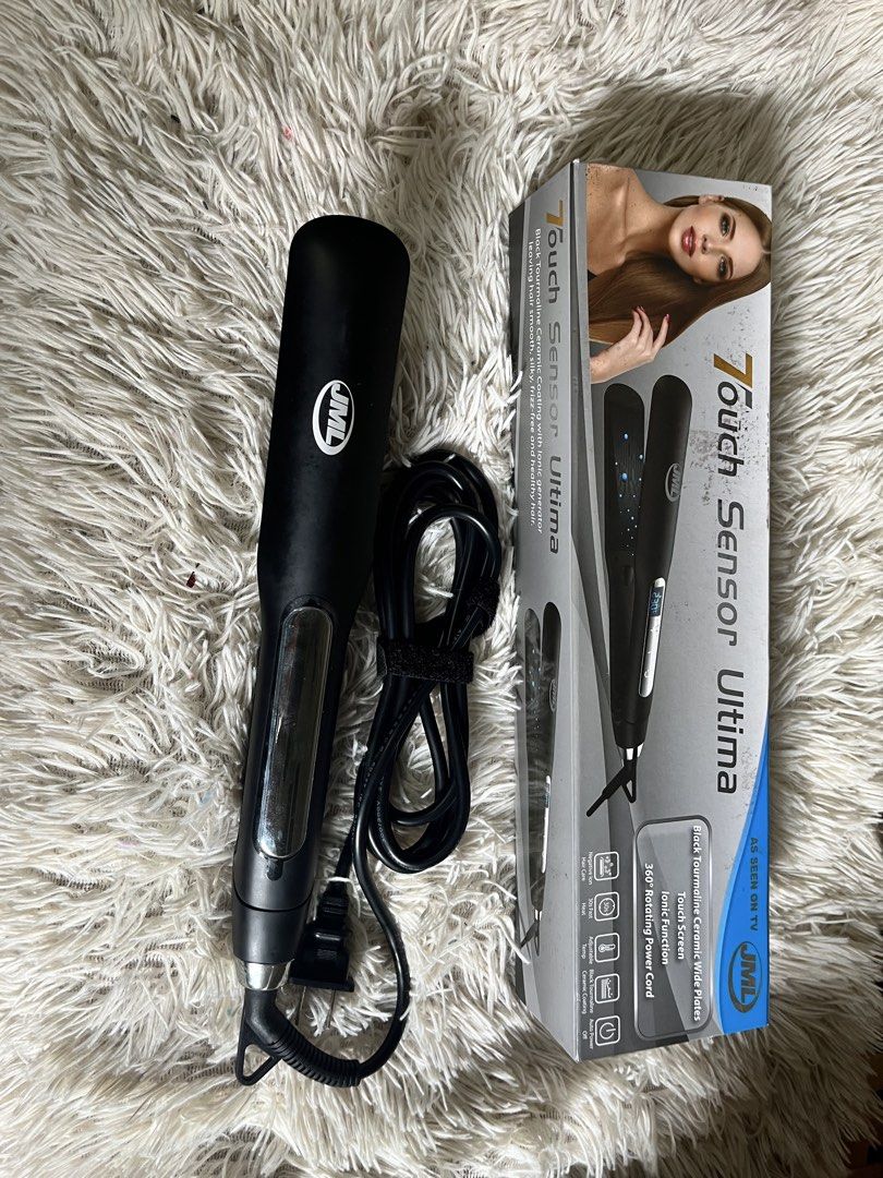 JML Touch Sensor Ultima Hair Straightener (Category: Hair) located in Manila. Submitted by jenngarcia110791 (Listing ID 1466208421, Image 2). Description: - Brand: JML Touch Sensor Ultima - Color: Black - Condition: Powers on and heats evenly, comes with original box - Plates: Black tourmaline ceramic wide plates - Features: Touch screen controls, ionic function, and adjustable temperature settings - Convenience: 360-degree rotating power cord wi