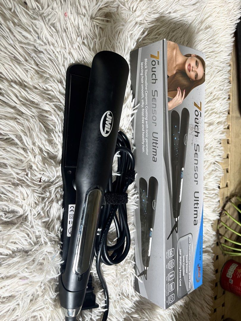 JML Touch Sensor Ultima Hair Straightener (Category: Hair) located in Manila. Submitted by jenngarcia110791 (Listing ID 1466208421, Image 1). Description: - Brand: JML Touch Sensor Ultima - Color: Black - Condition: Powers on and heats evenly, comes with original box - Plates: Black tourmaline ceramic wide plates - Features: Touch screen controls, ionic function, and adjustable temperature settings - Convenience: 360-degree rotating power cord wi