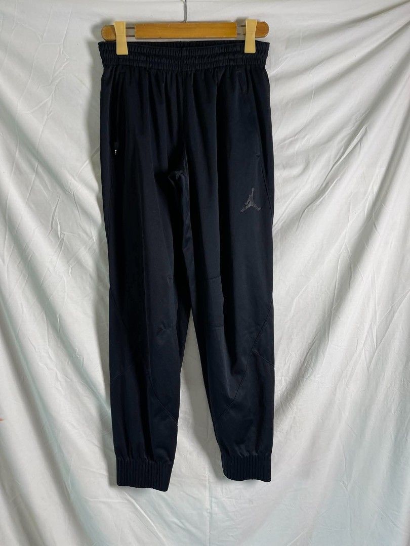 Jordan Black Track Pants Size L (Category: Joggers) located in Manila. Submitted by japee55 (Listing ID 1466321535, Image 1). Description: - Brand: Jordan - Color: Black - Size: Large - Material: 100% polyester - Waistband: Elastic with Jumpman logo near the left pocket - Cuffs: Ribbed at the bottom ankles - Condition: Brand new with tags attached showing care and sizing info.