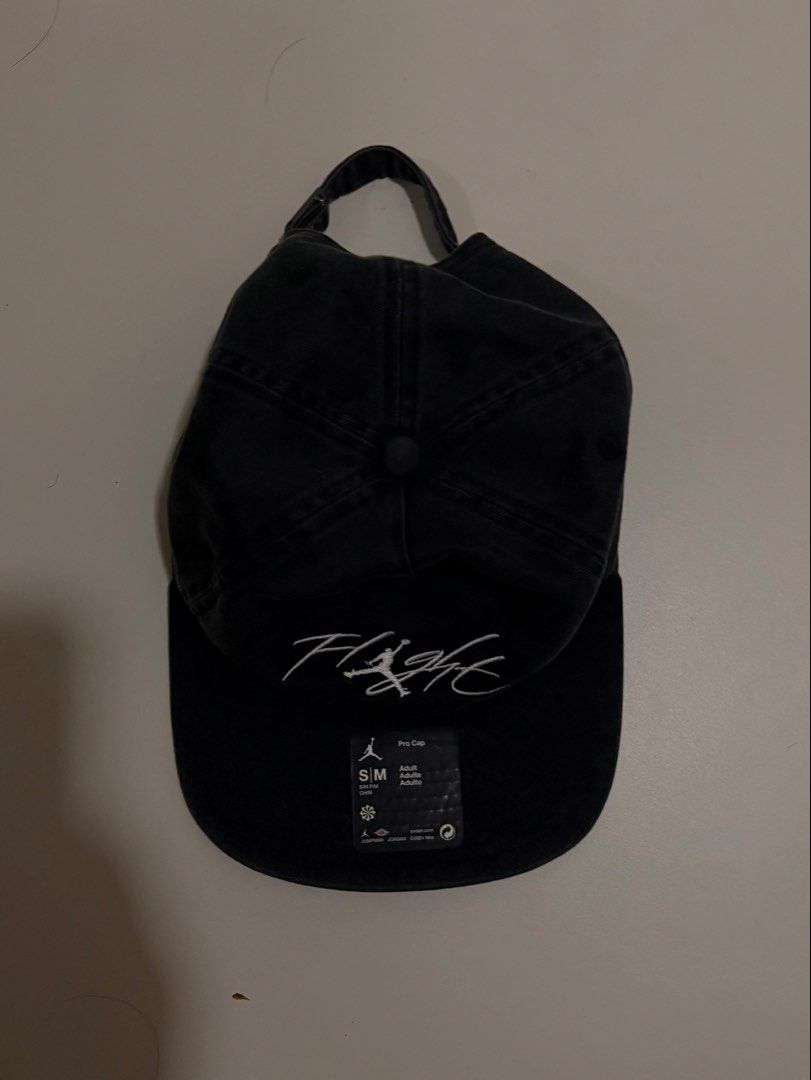 JORDAN Flight Pro Cap (Category: Caps & Hats) located in Mandaluyong City. Submitted by alexadkdy (Listing ID 1466320524, Image 1). Description: - Authentic Jordan Flight Pro Cap - Color: Black - Size: S/M - Adjustable strap - Embroidered Flight logo - Good preloved condition - Clean interior and sweatband - No major stains, tears, or defects RFS: Decluttering.