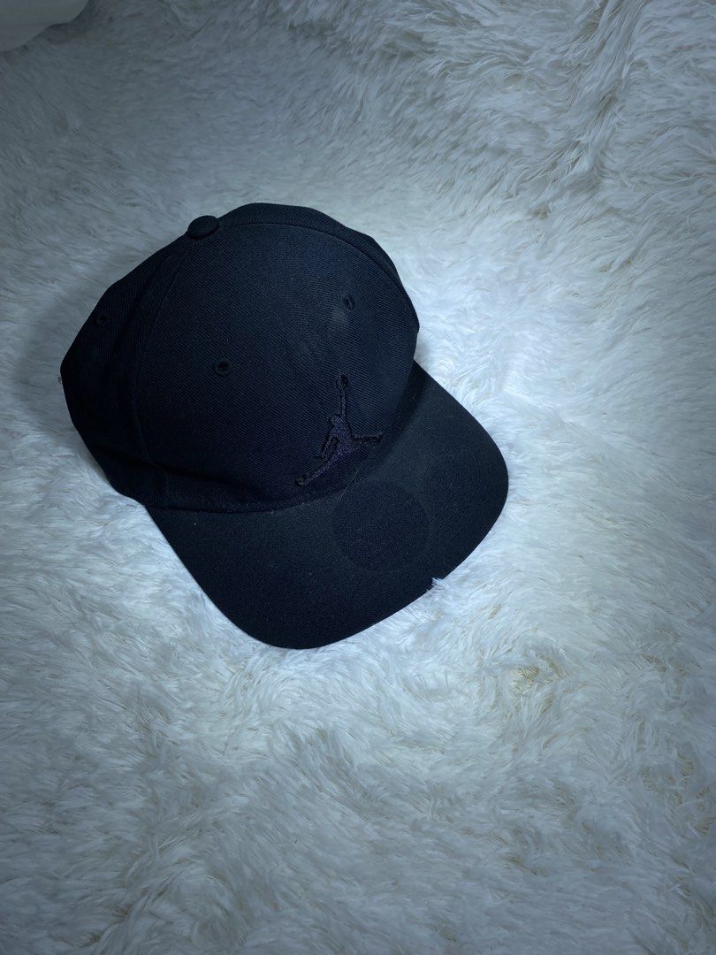 Jordan Jumpman Black Cap with Floral Undervisor (Category: Caps & Hats) located in Manila. Submitted by arthurmtb25357 (Listing ID 1466221405, Image 1). Description: - Brand: Jordan - Color: Black - Condition: Clean, great pre-loved condition - Design: Embroidered Jumpman logo on the front with a vibrant floral print under the brim and on the strapback - Details: Branded metal clasp closure and Jumpman text printed on the inside taped seams - Fit