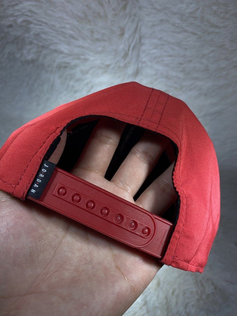 Jordan Jumpman Red Snapback Cap (Category: Caps & Hats) located in Manila. Submitted by arthurmtb25357 (Listing ID 1466221534, Image 2). Description: - 100% Authentic Jordan snapback cap in bright red - Classic black Jumpman embroidered logo on the front - Adjustable snapback closure for a custom fit - Features interior Jordan tape detailing and style code AV8439-687 tags - Original brim sticker still attached - Clean, structured panels and prist