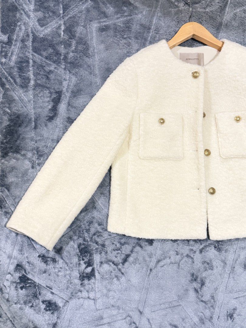 Jusglitty White Boucle Tweed Jacket Gold Buttons Size 2 (Category: Coats, Jackets and Outerwear) located in Manila. Submitted by yeti_it (Listing ID 1466257852, Image 3). Description: Brand: Jusglitty Color: Cream Size: 2 (fits S-M) Material: Cozy fuzzy texture Design: Round neckline, front button closure with embossed gold hardware, and two chest flap pockets Details: Includes branded inner tag and chain locker loop Condition: Excellent pre-love