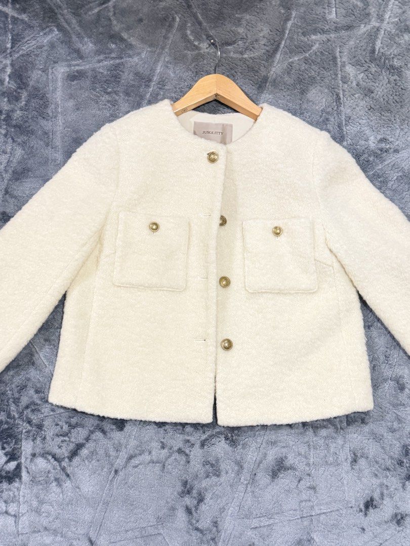 Jusglitty White Boucle Tweed Jacket Gold Buttons Size 2 (Category: Coats, Jackets and Outerwear) located in Manila. Submitted by yeti_it (Listing ID 1466257852, Image 2). Description: Brand: Jusglitty Color: Cream Size: 2 (fits S-M) Material: Cozy fuzzy texture Design: Round neckline, front button closure with embossed gold hardware, and two chest flap pockets Details: Includes branded inner tag and chain locker loop Condition: Excellent pre-love
