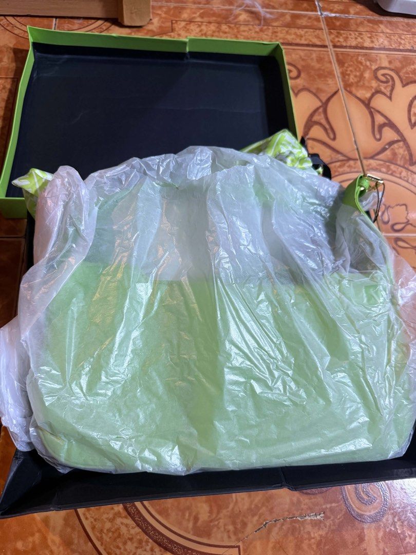 JW Pei Green Handbag (Category: Shoulder Bags) located in Calamba. Submitted by liitchika (Listing ID 1466319584, Image 1). Description: - Brand: JW Pei - Color: Bright neon green - Condition: Brand new, never taken out of packaging - Features: Structured shape with gold foil logo - Inclusions: Original black and green presentation box with protective plastic wrapping.