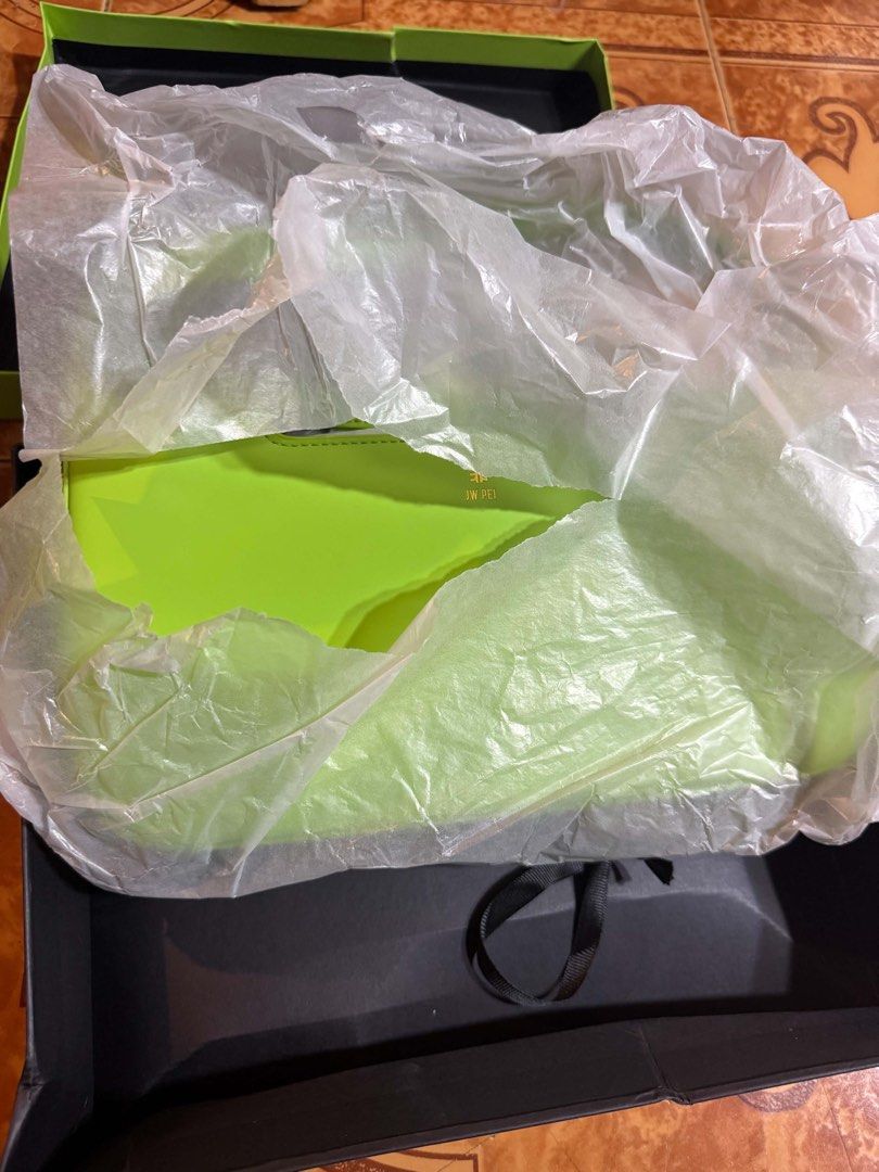 JW Pei Green Handbag (Category: Shoulder Bags) located in Calamba. Submitted by liitchika (Listing ID 1466319584, Image 2). Description: - Brand: JW Pei - Color: Bright neon green - Condition: Brand new, never taken out of packaging - Features: Structured shape with gold foil logo - Inclusions: Original black and green presentation box with protective plastic wrapping.