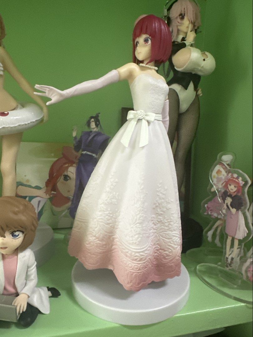 Kana Arima figure (Category: Figurines & Statues) located in Manila. Submitted by silentfire.54ea36 (Listing ID 1465750447, Image 1). Description: - Pink-haired anime figure in a stunning white strapless wedding dress - Features delicate floral embroidery and a lovely pink gradient hem - Includes long matching gloves, pearl necklace, and small hair accessory - Detailed white bow belt with a rose accent at the waist - Condition: Clean, well-mainta