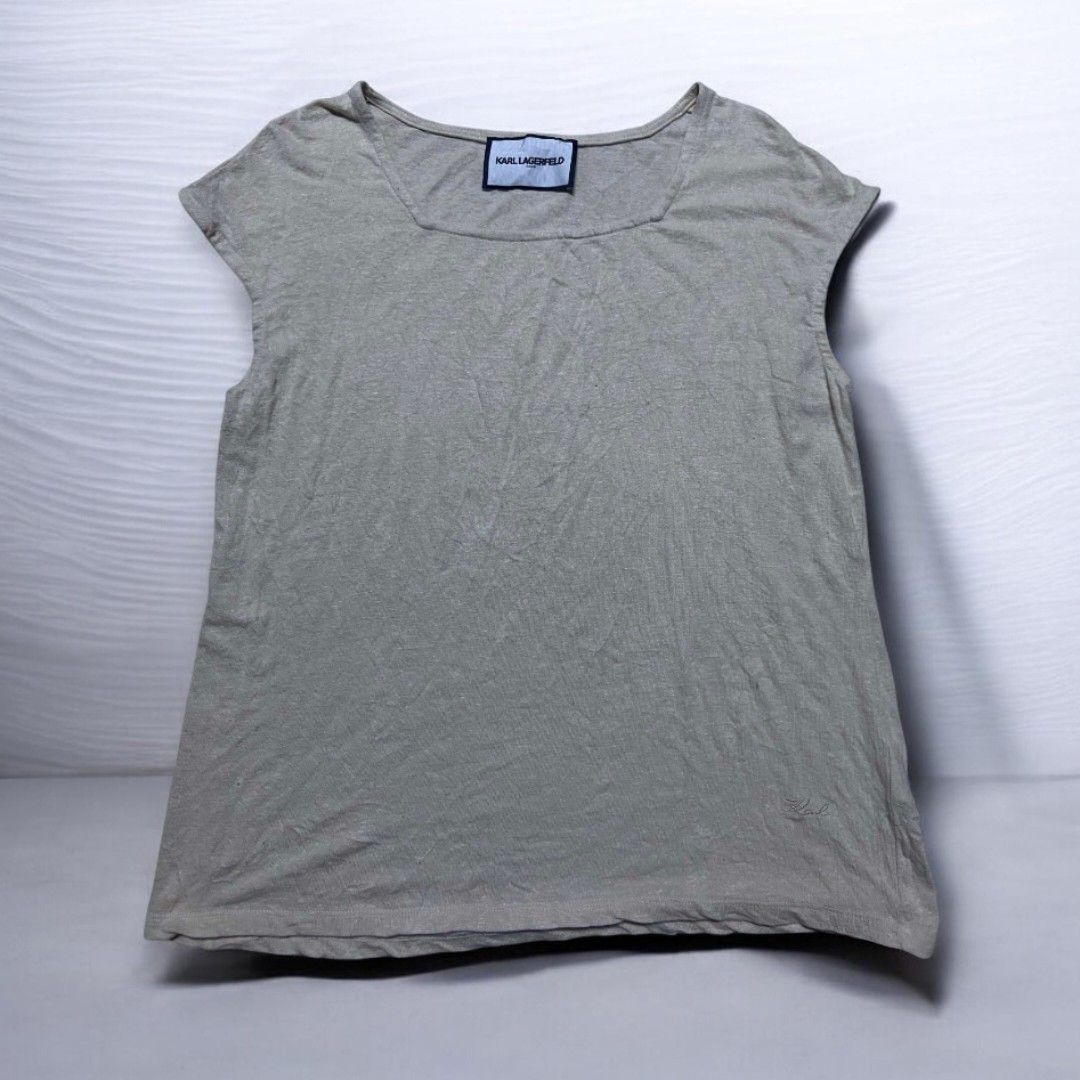 Karl Lagerfeld square-neck capped sleeve top. (Category: Others Tops) located in Sindangan. Submitted by barak_ukay (Listing ID 1465911462, Image 1). Description: Color:light beige / sand / oatmeal color White-22x18 Good condition No issue.