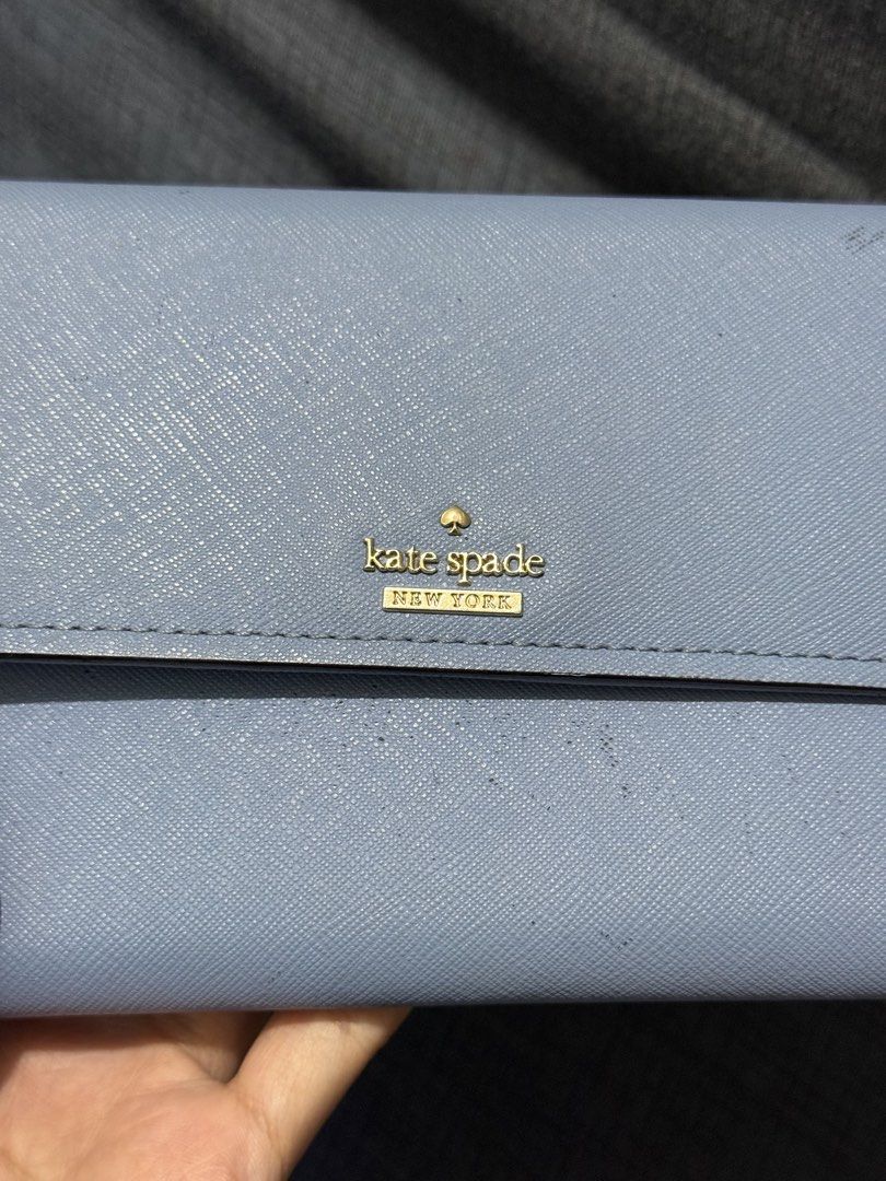 Kate Spade sling wallet (Category: Wallets & Card holders) located in Bocaue. Submitted by quickfish.3fde35 (Listing ID 1466312504, Image 3). Description: Napabayaan lang sa closet 😓 Okay pa yung body, can be used as long wallet Yung strap pwede pa naman :)) Super mabago pa sana, check photos nung linings sa loob :)).