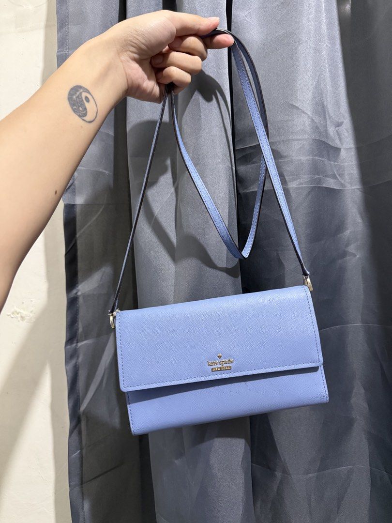 Kate Spade sling wallet (Category: Wallets & Card holders) located in Bocaue. Submitted by quickfish.3fde35 (Listing ID 1466312504, Image 1). Description: Napabayaan lang sa closet 😓 Okay pa yung body, can be used as long wallet Yung strap pwede pa naman :)) Super mabago pa sana, check photos nung linings sa loob :)).