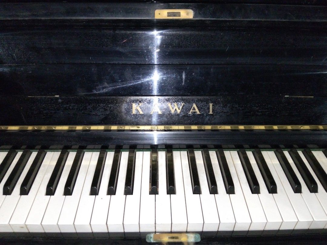 Kawai BL-31 Upright Piano (Category: Musical Instruments) located in Abucay. Submitted by cristineca20489 (Listing ID 1466330210, Image 2). Description: - Model: Kawai BL-31 upright piano - Finish: Classic polished black - Inclusions: Matching dark burgundy cushioned bench and keyboard felt cover - Condition: Solid acoustic performance with minor surface scuffs from normal handling - from Japan .