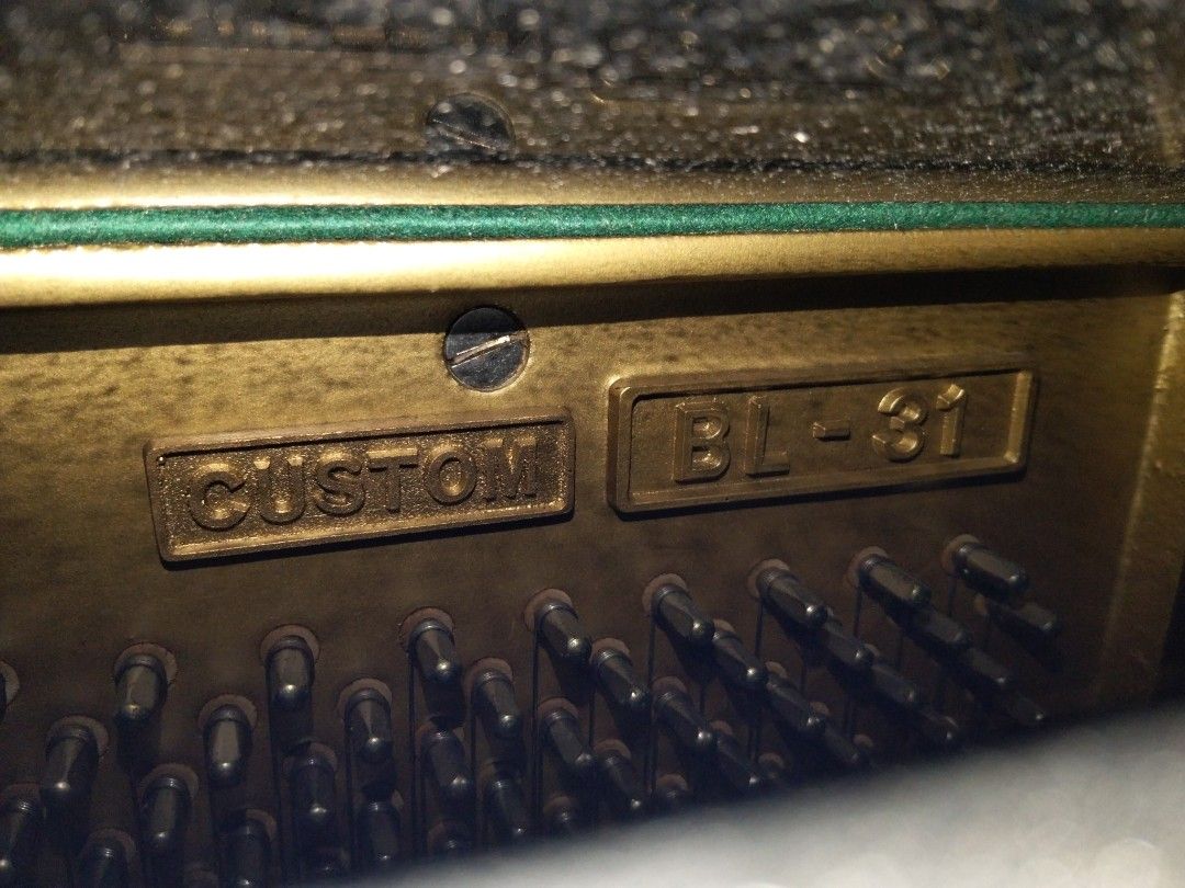 Kawai BL-31 Upright Piano (Category: Musical Instruments) located in Abucay. Submitted by cristineca20489 (Listing ID 1466330210, Image 3). Description: - Model: Kawai BL-31 upright piano - Finish: Classic polished black - Inclusions: Matching dark burgundy cushioned bench and keyboard felt cover - Condition: Solid acoustic performance with minor surface scuffs from normal handling - from Japan .