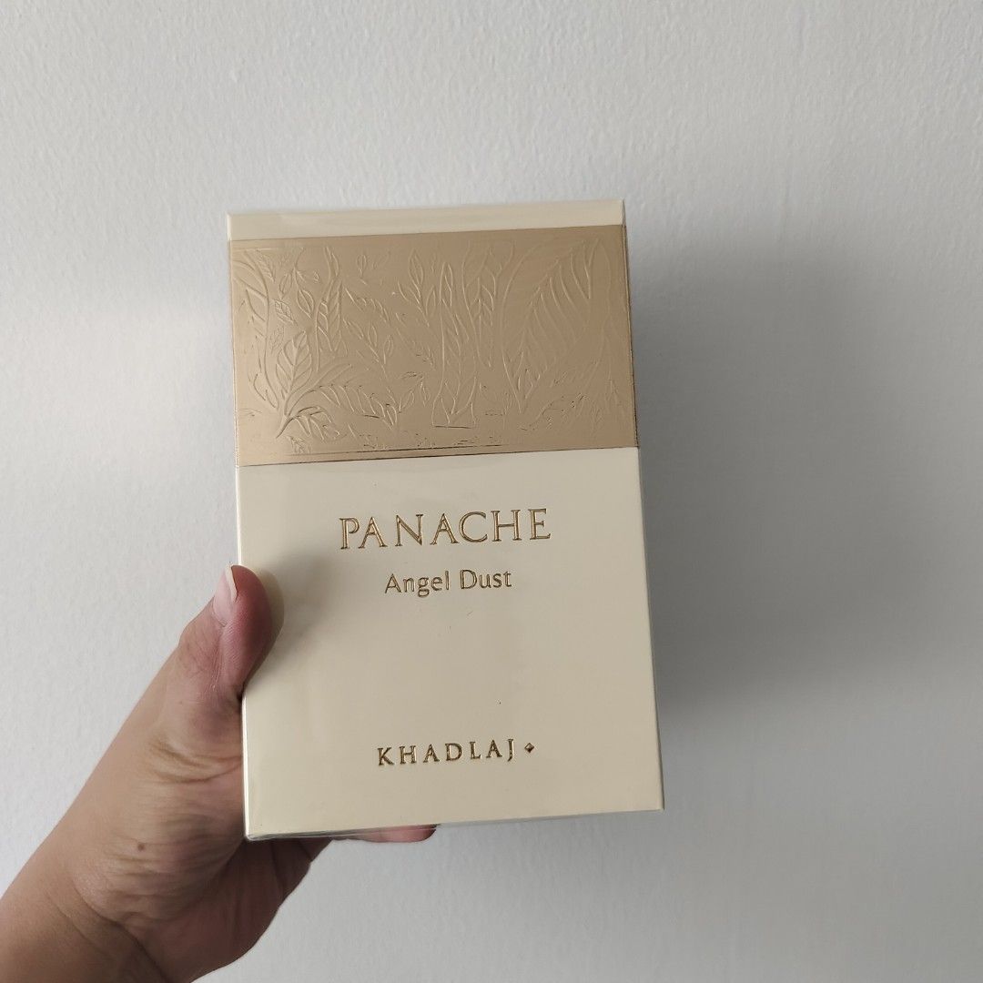 Khadlaj Panache Angel Dust Extrait De Parfum 100ml (Category: Fragrance & Deodorants) located in Manila. Submitted by briezzy90266 (Listing ID 1466192373, Image 1). Description: - Item: Khadlaj Panache Angel Dust Extrait de Parfum - Size: 100ml - Condition: Brand new, factory sealed in original box - Packaging: Features elegant gold embossed botanical details on top - Concentration: Rich and long-lasting extrait de parfum.