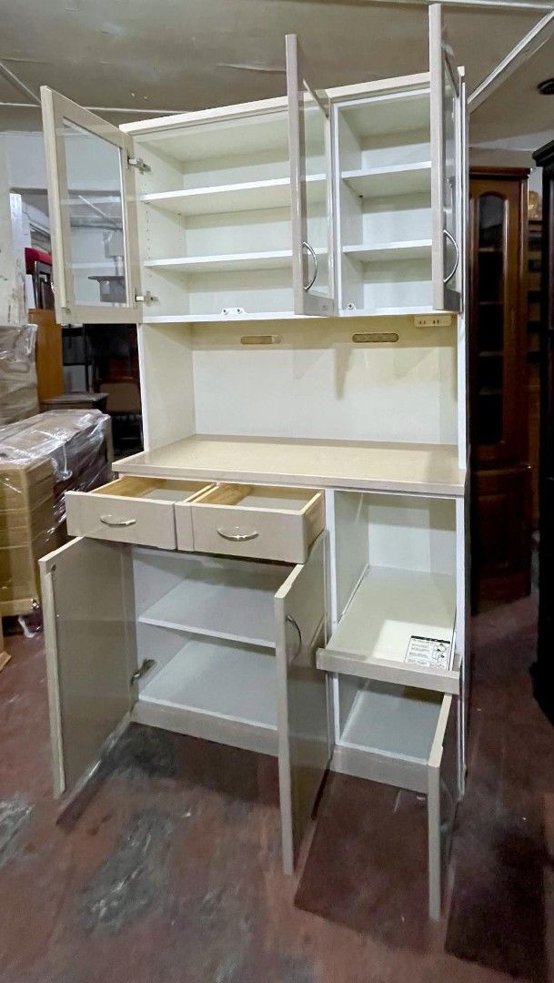Kitchen Cupboard Display Hutch Cabinet (Category: Shelves, Cabinets & Racks) located in Quezon City. Submitted by dannikkishoppe2 (Listing ID 1466235822, Image 3). Description: Kitchen Cupboard Display Hutch Cabinet ‼️₱12000‼️ • Dimensions: approx. 75" H x 41.5" L x 17" W • Upper glass cabinets with adjustable shelves • Two convenient pull-out drawers and spacious lower cabinet space • Dedicated appliance slot with a small storage door underneath