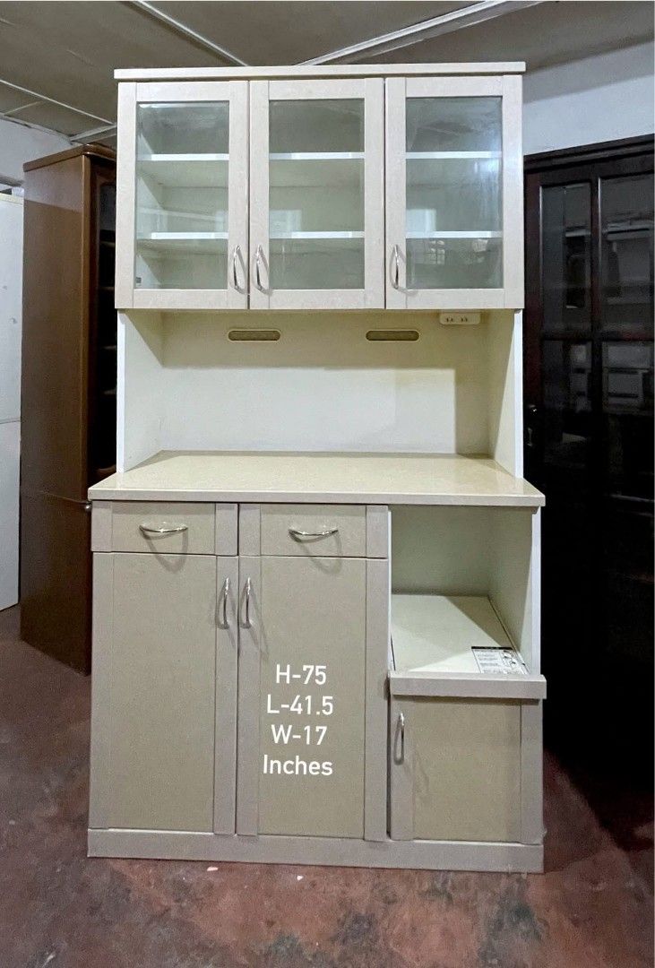 Kitchen Cupboard Display Hutch Cabinet (Category: Shelves, Cabinets & Racks) located in Quezon City. Submitted by dannikkishoppe2 (Listing ID 1466235822, Image 2). Description: Kitchen Cupboard Display Hutch Cabinet ‼️₱12000‼️ • Dimensions: approx. 75" H x 41.5" L x 17" W • Upper glass cabinets with adjustable shelves • Two convenient pull-out drawers and spacious lower cabinet space • Dedicated appliance slot with a small storage door underneath