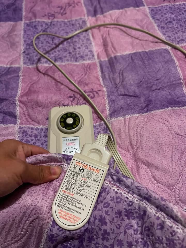 Korean Electric Heating Mat with Auto Controller (Category: Home Improvement Tools & Accessories) located in Baguio. Submitted by ljen2574460 (Listing ID 1466336760, Image 2). Description: Purple checkered electric mat, made in Korea. Runs on 220V with 140W power consumption. Includes original auto temperature controller attached. Folds up easily for storage when not in use. Keeps you warm during cold nights. Clean condition overall, works well..