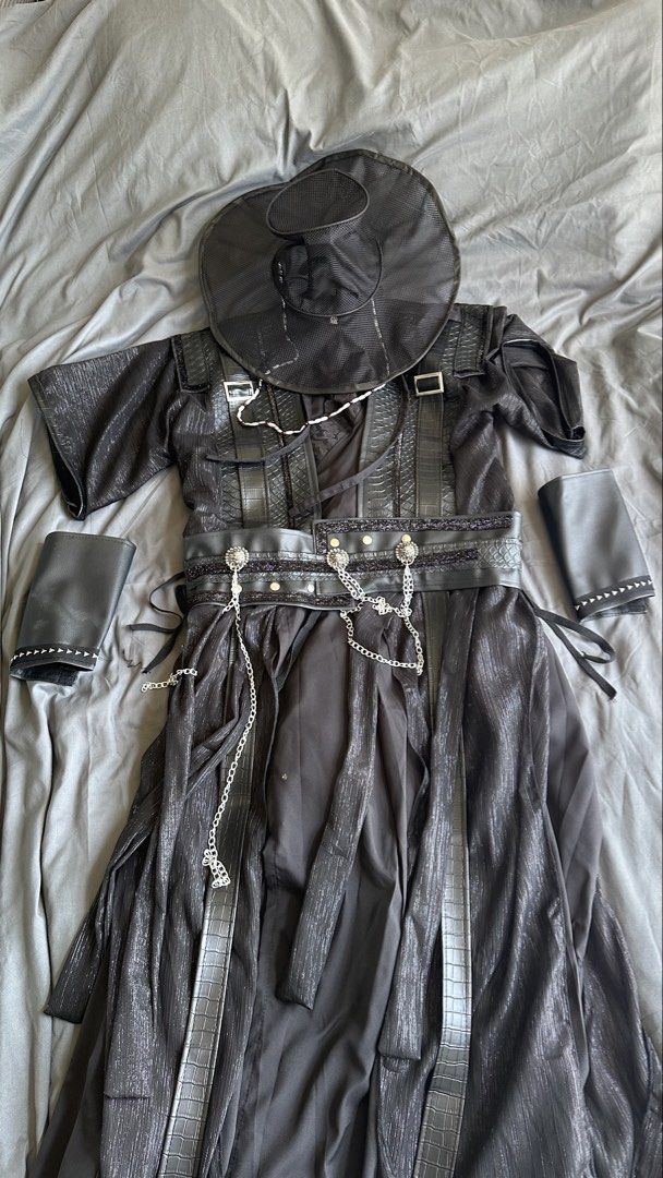 KPOP DEMON HUNTER JINU HANBOK COSTUME (Category: Sets & Coordinates) located in Alaminos. Submitted by akiinoji (Listing ID 1466178125, Image 2). Description: - Sold as set - Complete black handbok set inspired by KPOP Demon Hunter Jinu (Size M) - Includes traditional hanbok hat, textured robe with faux-leather buckles, wide waist belt with metal chains, and two wrist guards - Eye-catching metallic sheen fabric throughout for a standout look - Pe