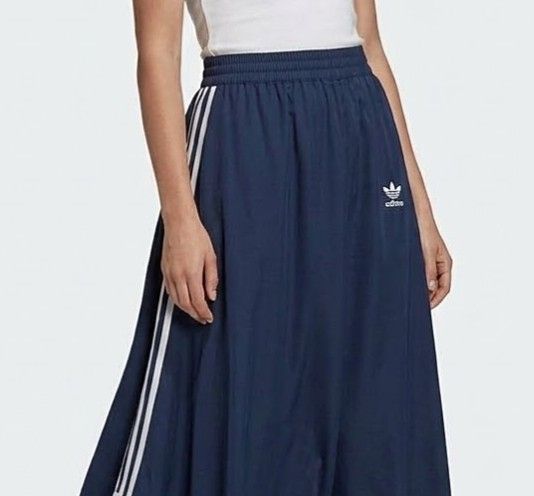 (L-2XL) Adidas Navy Maxi Skirt (Category: Skirts) located in Rodriguez. Submitted by ginghamgirlie (Listing ID 1466257842, Image 1). Description: SIZE ON TAG: L BEST FITS: L-2XL MEASUREMENTS waist: 32-36 inches hips: 50 inches length: 32 inches 📌 PLEASE NOTE • Sizing is based on the actual measurements of the garment, not the tagged size. • Pre-owned pieces may differ from the tagged size due to stretching, shrinkage, wear, alterations, or label