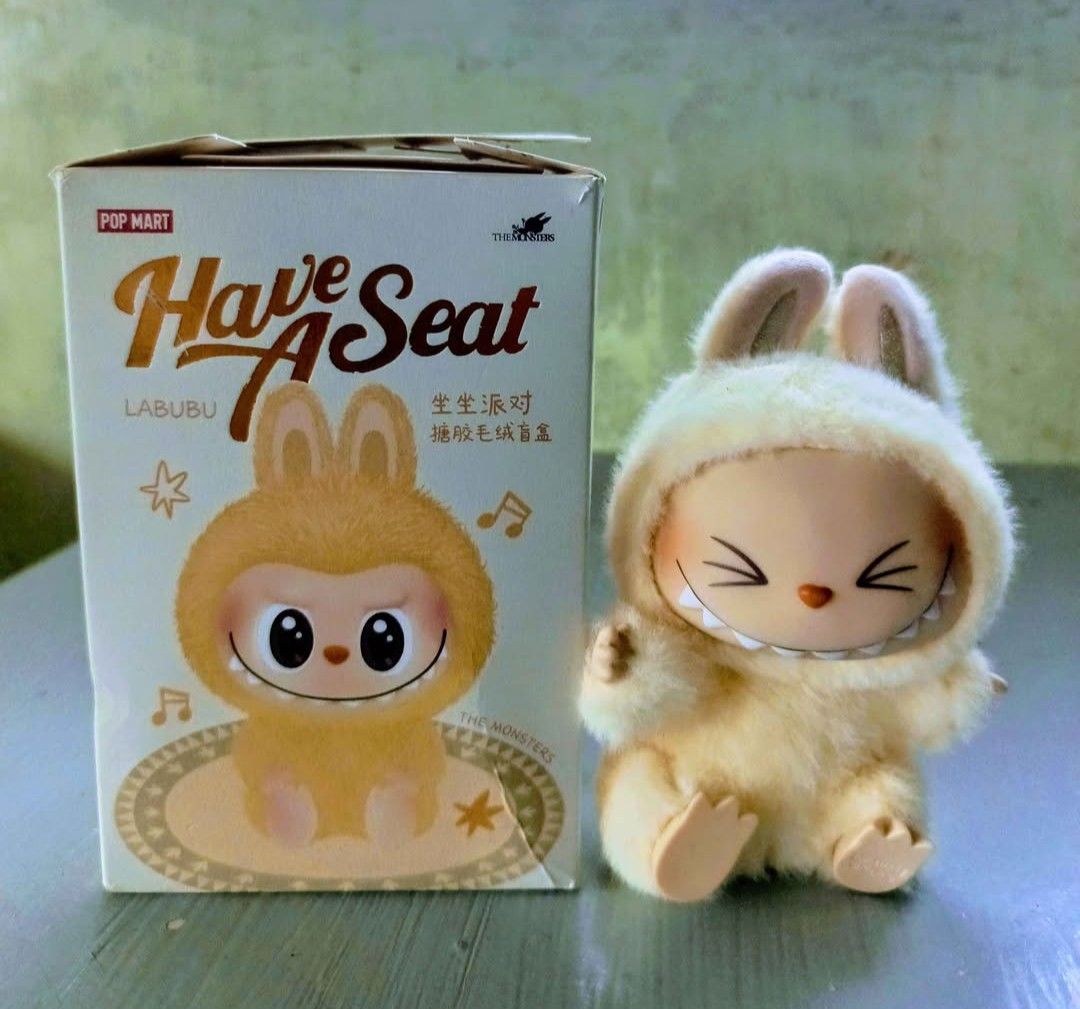 LABUBU (Category: Character Goods) located in Binan City. Submitted by jaycey_028 (Listing ID 1466334065, Image 3). Description: FS.POP MART THE MONSTERS Labubu Have a Seat Vinyl Plush Pendant Blind Box. Collectible stuffed plush pendant Size:17cm in height Material: PVC and polyester Price: 350 Meet up or ship via JNT or Lalamove.