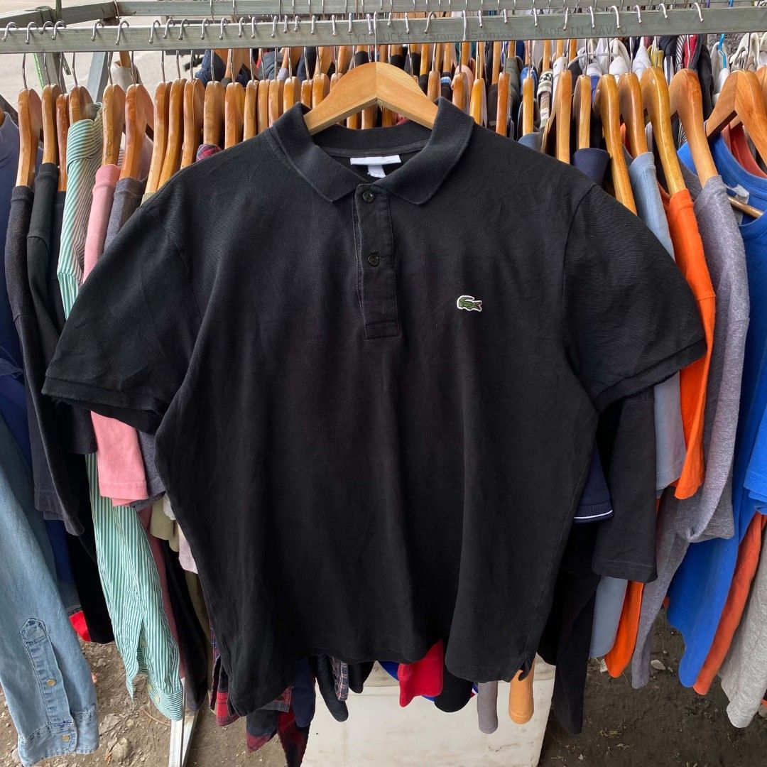 Lacoste Black Polo Shirt (Category: Tshirts & Polo Shirts ) located in Lupon. Submitted by kent_thrift (Listing ID 1466203300, Image 1). Description: -Dimes: 21x26 -Size:XL on tag -Issue Nickline -1200Ship - Authentic Black Lacoste Polo Shirt - Classic button placket and collar - Iconic embroidered crocodile logo on left chest - Standard fit with short sleeves - Ribbed collar and sleeve cuffs - Versatile, pairs easily with jeans or shorts - Condi