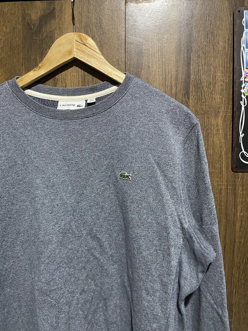 Lacoste Grey Crewneck Sweatshirt (Category: Coats, Jackets and Outerwear) located in Antipolo. Submitted by cogiestamaria (Listing ID 1466262229, Image 3). Description: - Brand: Lacoste - Color: Grey heather - Size: French 4 (US Medium) - dimes W22-L26.5 - no issue - color rate 10-10 - good as new - Style: Crewneck sweatshirt with ribbed cuffs and hem - Logo: Classic embroidered green crocodile on the chest - Condition: Clean inside collar, neat 