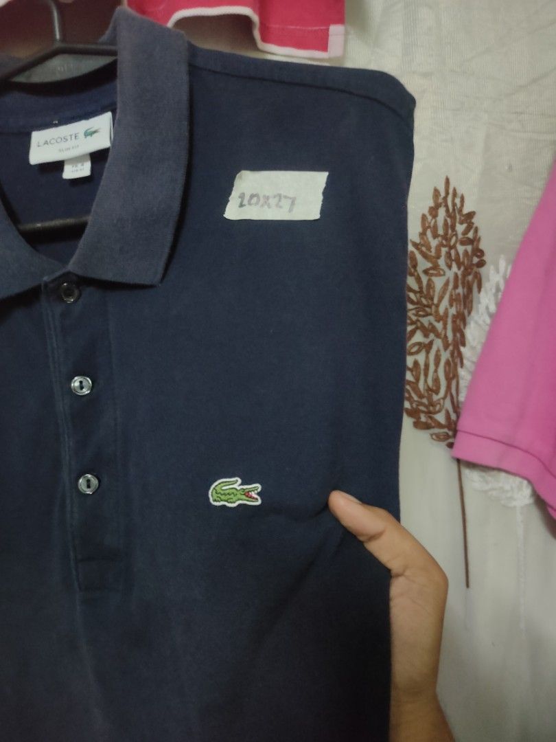 Lacoste Navy Blue Polo Shirt (Category: Tshirts & Polo Shirts ) located in Manila. Submitted by montillano25396 (Listing ID 1466281447, Image 3). Description: Lacoste Navy Blue Polo Shirt Size: Large Good Condition issue: fadings on collar.