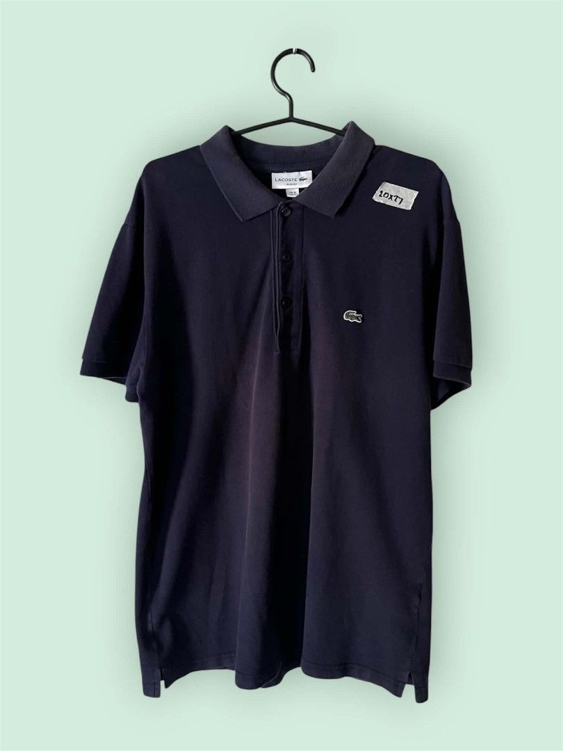 Lacoste Navy Blue Polo Shirt (Category: Tshirts & Polo Shirts ) located in Manila. Submitted by montillano25396 (Listing ID 1466281447, Image 1). Description: Lacoste Navy Blue Polo Shirt Size: Large Good Condition issue: fadings on collar.