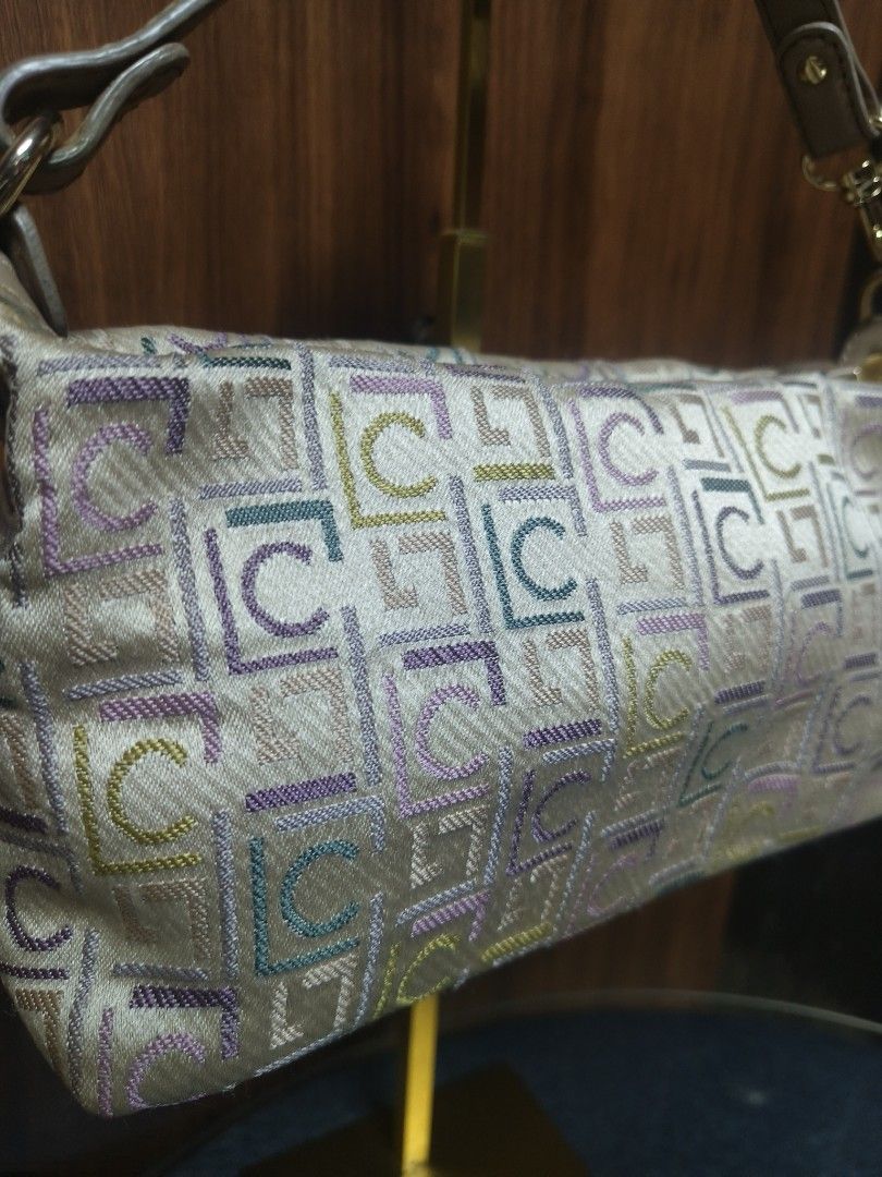 LC Multicolor Monogram Jacquard Baguette/Pouch Bag (Category: Clutches) located in Baguio. Submitted by PreiLoveMaria (Listing ID 1466308158, Image 3). Description: LC ​Multicolor Monogram Jacquard Baguette/Pouch Bag Trendy and vibrant multi-tone jacquard monogram pattern featuring pastel shades (lavender, teal, lime, and neutral tones). ​Equipped with a detachable neutral-toned shoulder strap secured by polished gold-tone metal hardware and lobs