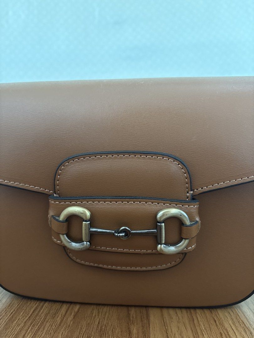 Leather Bag (Category: Shoulder Bags) located in Paranaque City. Submitted by krystelmay_williams (Listing ID 1466195491, Image 3). Description: Genuine Leather - Brown (Horse Shoe Buckle) Made in ITALY Original Price: 6,000 No issue Rating: 10/10 ⭐️.