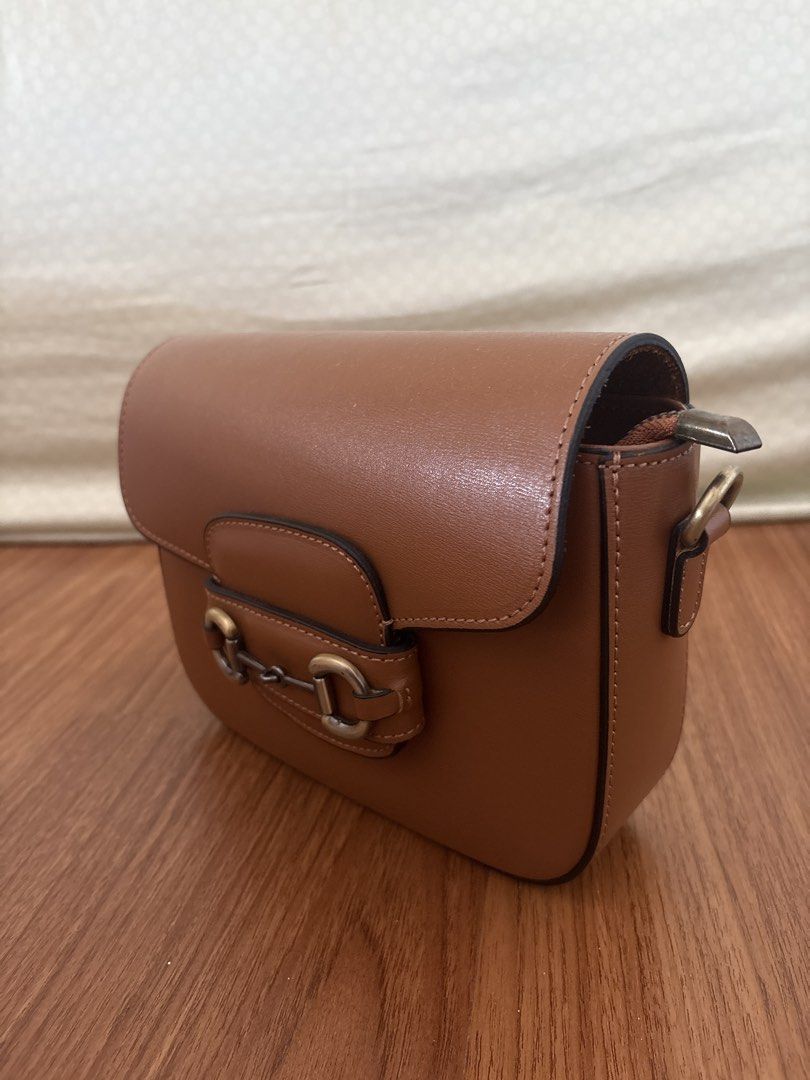 Leather Bag (Category: Shoulder Bags) located in Paranaque City. Submitted by krystelmay_williams (Listing ID 1466195491, Image 2). Description: Genuine Leather - Brown (Horse Shoe Buckle) Made in ITALY Original Price: 6,000 No issue Rating: 10/10 ⭐️.