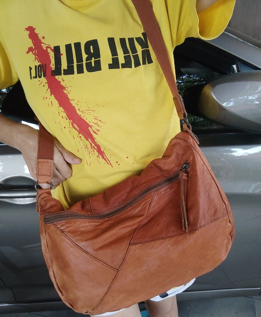 Leather sling bag (Category: Cross-body Bags) located in Cainta. Submitted by allauthenticbymj (Listing ID 1466247230, Image 3). Description: brand: AndA genuine cowhide leather sling bag unised/new condition no issue price:650 last price posted ***buyer shoulders sf LOCATION: CAINTA Courier choices and MOP Gogo express (cod option) LBC (pay sf first-- cop for the item's amount) J&t (gcash payment) Lalamove for same day delivery Gcash payment.