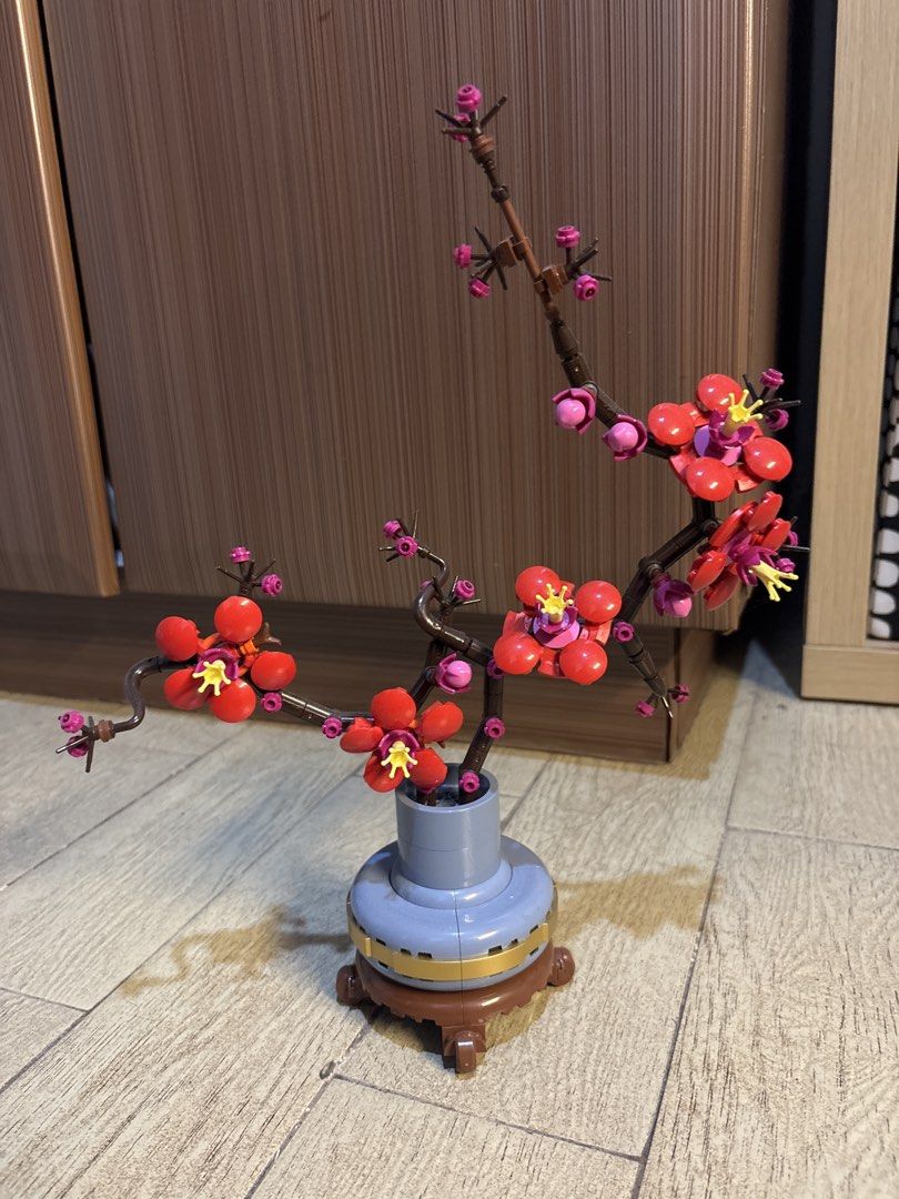 LEGO Plum Blossom Botanical Collection Set (Category: Lego & Building Sets) located in Manila. Submitted by babyspice011 (Listing ID 1466241597, Image 1). Description: - Authentic LEGO Plum Blossom set from the Botanical Collection - Fully assembled and ready for display - Features detailed brown branches with vibrant red and pink flowers and yellow centers - Comes in a stylish light blue pot with a brown wooden-style base - Clean, dust-free cond