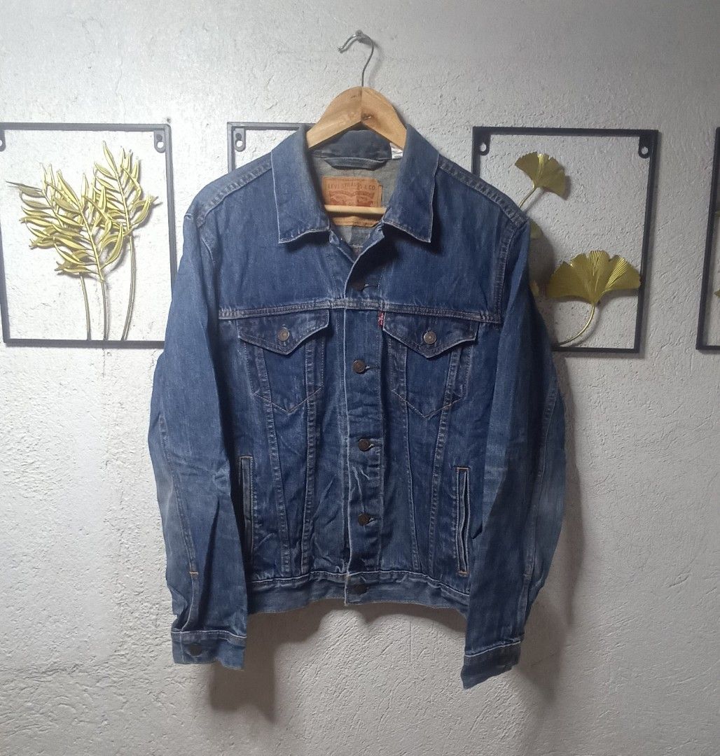 Levi's Denim Jacket Size M (Category: Coats, Jackets and Outerwear) located in Kawit. Submitted by deidzdzn (Listing ID 1466216974, Image 3). Description: - Brand: Levi's - Style: Classic denim jacket in dark blue wash - Size: M (Width: 21.5 inches, Length: 24 inches) - Features: Button-up front, chest pockets, and side welt pockets - Condition: Timeless piece, perfect for everyday wear.
