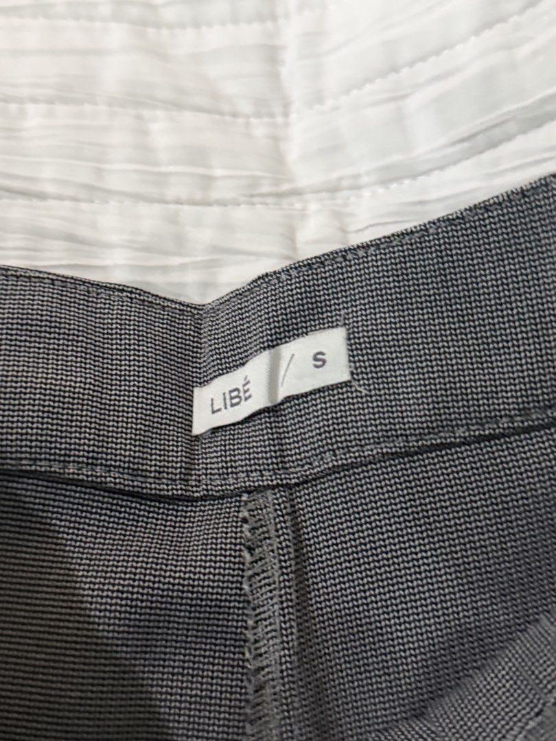 LIBÉ Gray Pleated Trousers Size S (Category: Trousers) located in Quezon City. Submitted by afternoonstore (Listing ID 1466211675, Image 2). Description: - Brand: LIBÉ - Size: Small - Style: Tailored fit with front pleats and belt loops - Color: Versatile neutral gray (matches any top) - Occasion: Ideal for office wear or casual outings - Condition: Clean and well-maintained.