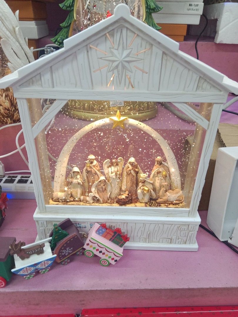 Lighted Christmas Nativity Snow Globe Water Lantern Barn Scene (Category: Vintage Collectibles) located in Manila. Submitted by iliasjen3082126 (Listing ID 1466167315, Image 1). Description: - Elegant white lantern with a detailed nativity scene inside (Mary, Joseph, baby Jesus, angels, and animals) - Features a magical floating glitter snow effect when turned on - Designed with a cute star cutout at the top roof and an arch with a star overhead 