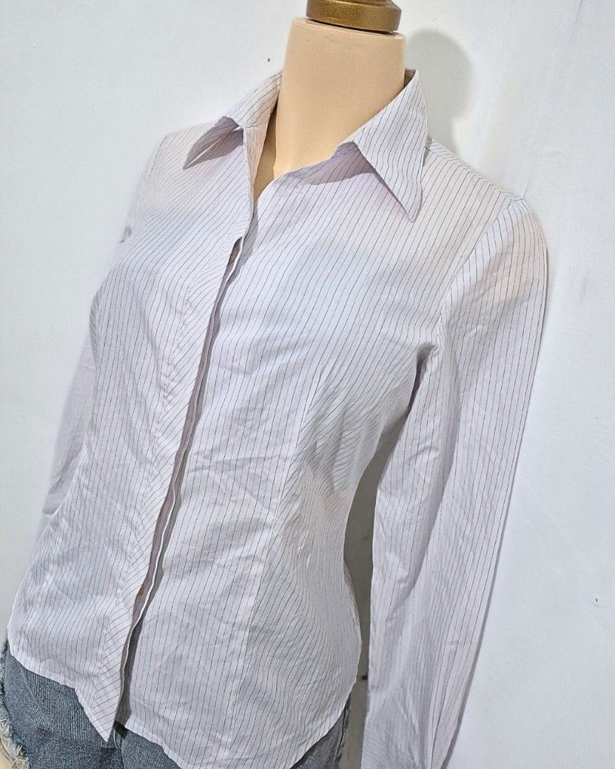 Lilac Pinstripe Fitted Blouse | Long Sleeve Button Down | S-M (Category: Longsleeves) located in Cabanatuan. Submitted by _erboutique (Listing ID 1466330139, Image 2). Description: • Pale lilac fine vertical pinstripe shirt • Sharp pointed collar, hidden placket • Tailored slim fit, crisp fabric • Size S–M | Shoulder 15½" | Bust 36" | Length 24" • Minimal washable stain noted • Smart office formal business wear • Great preowned condition.