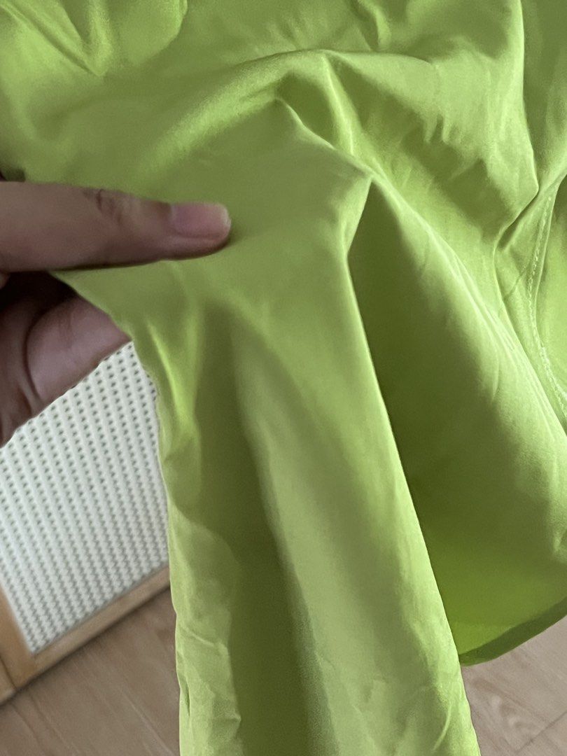 Lime Green Short Sleeve Statement Top with Back Zipper (Category: Dresses) located in Pili. Submitted by gaellecast (Listing ID 1466160267, Image 3). Description: Bright lime green asymmetrical top. Short cuffed sleeves, round neckline. Hidden back zipper closure runs down the upper back. Fitted waistline with a slight asymmetric hem flare. Smooth fabric texture. Simple, vibrant piece ready for casual outings..