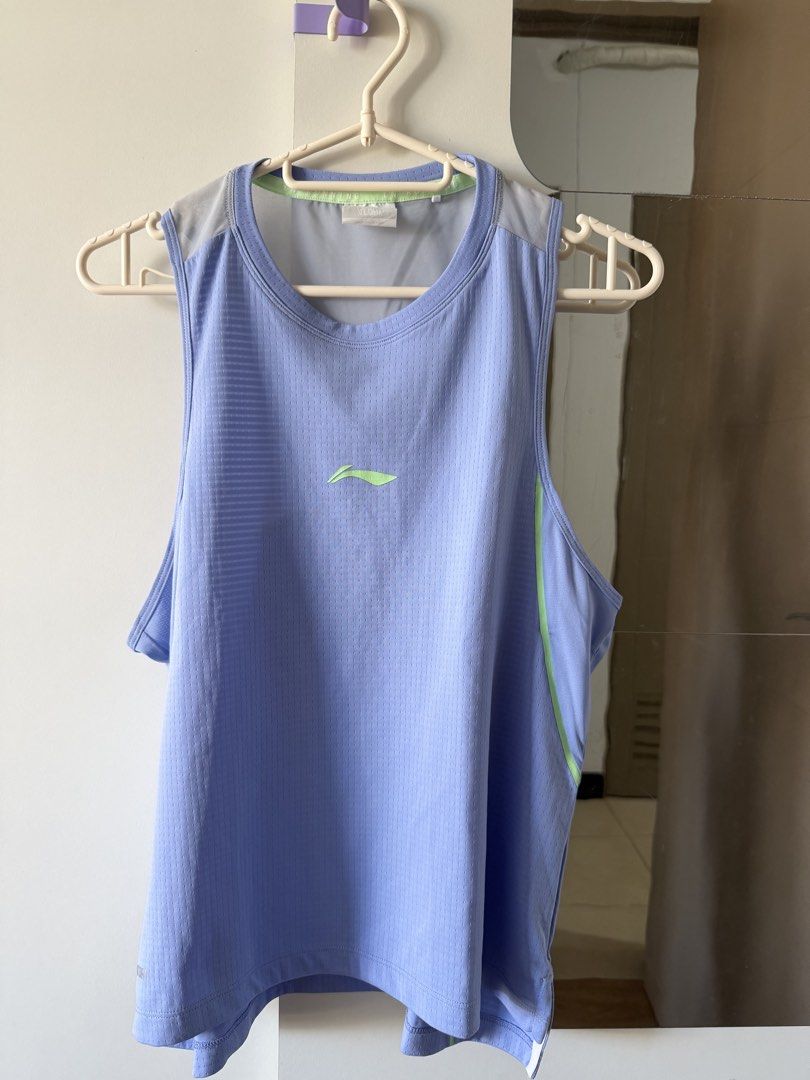 Li-Ning Running - Size S (Category: Activewear) located in Mandaluyong City. Submitted by rreynax (Listing ID 1466199393, Image 1). Description: - Brand: Li-Ning - Item: Athletic Running Tank Top - Color: Light blue with lime green logo and trim - Size: S - Technology: AT DRY moisture-wicking fabric - Design: Breathable mesh panels at the shoulders - Ideal for: Running, gym sessions, and sports - Condition: Clean and well-maintained.