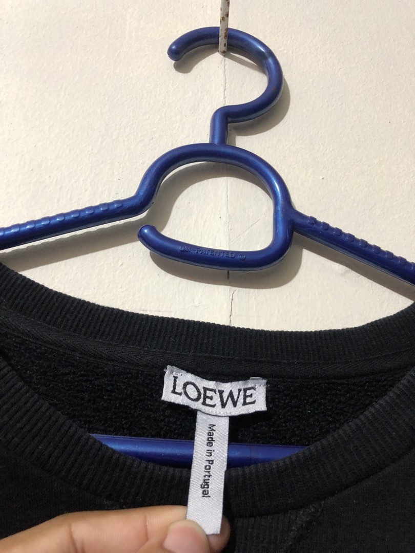 LOEWE Anagram Crewneck (Category: Earphones) located in Manila. Submitted by raremountain00 (Listing ID 1466320381, Image 3). Description: Authentic Excellent condition 21 x 25 dimes Medium Fit Men Large to xl Women No issue.