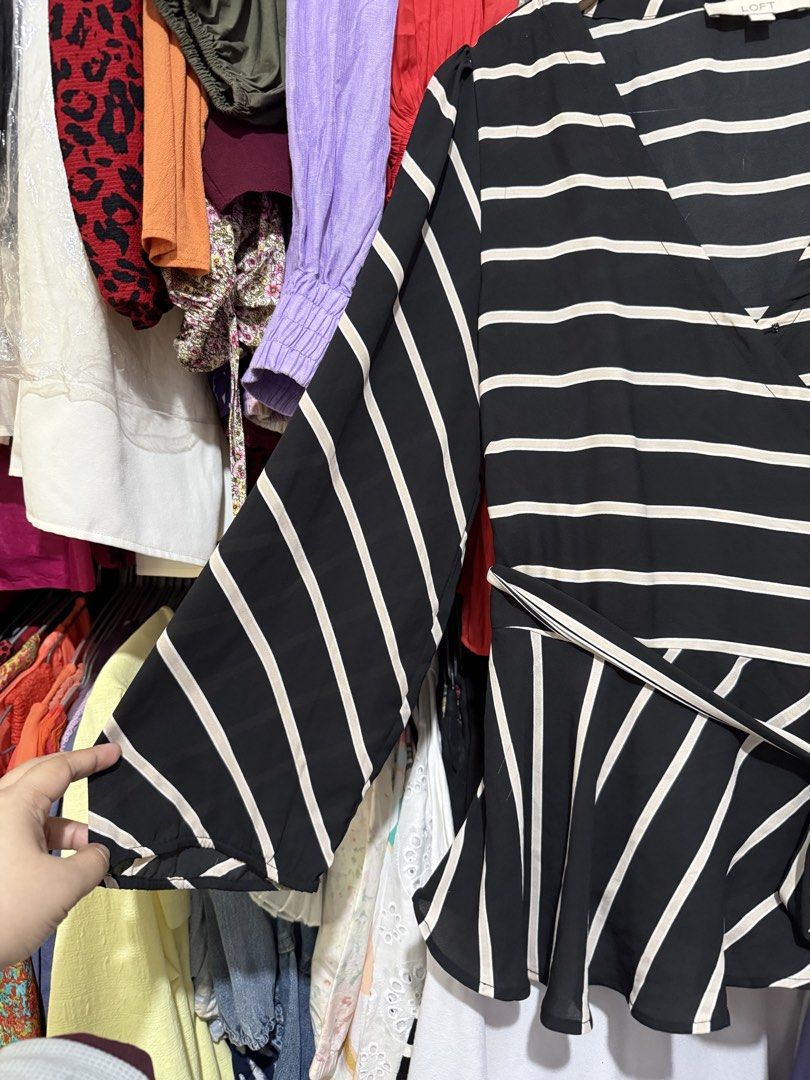 LOFT Black and White Striped Wrap Peplum Blouse (Category: Blouses) located in Antipolo. Submitted by harlowwillow (Listing ID 1466212593, Image 3). Description: NO TO LOW BALLERS Large on tag can fit up to XL W 20-22" L 27" - Brand: LOFT - Design: Black and white stripes with V-neck wrap front - Features: Matching tie belt at the waist, long sleeves with gathered shoulder details - Fabric: Lightweight and comfortable - Occasion: Versatile for wo