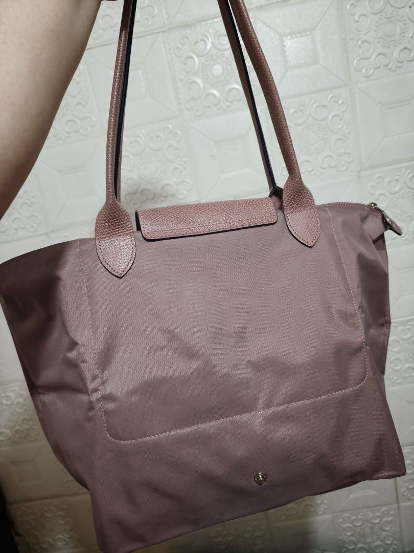 Longchamp Rose Pink Tote Bag (Category: Luxury Bags & Wallets) located in Pasig City. Submitted by purpleglitters (Listing ID 1466261784, Image 2). Description: - Color: Old Rose LLH - Style: Long-handled tote bag - Material: Durable nylon body with leather flap and snap closure - Hardware: Silver-toned top zipper - Interior: Spacious main compartment for daily essentials - Condition: Excellent / Well-maintained - Shipping: Nationwide via courier