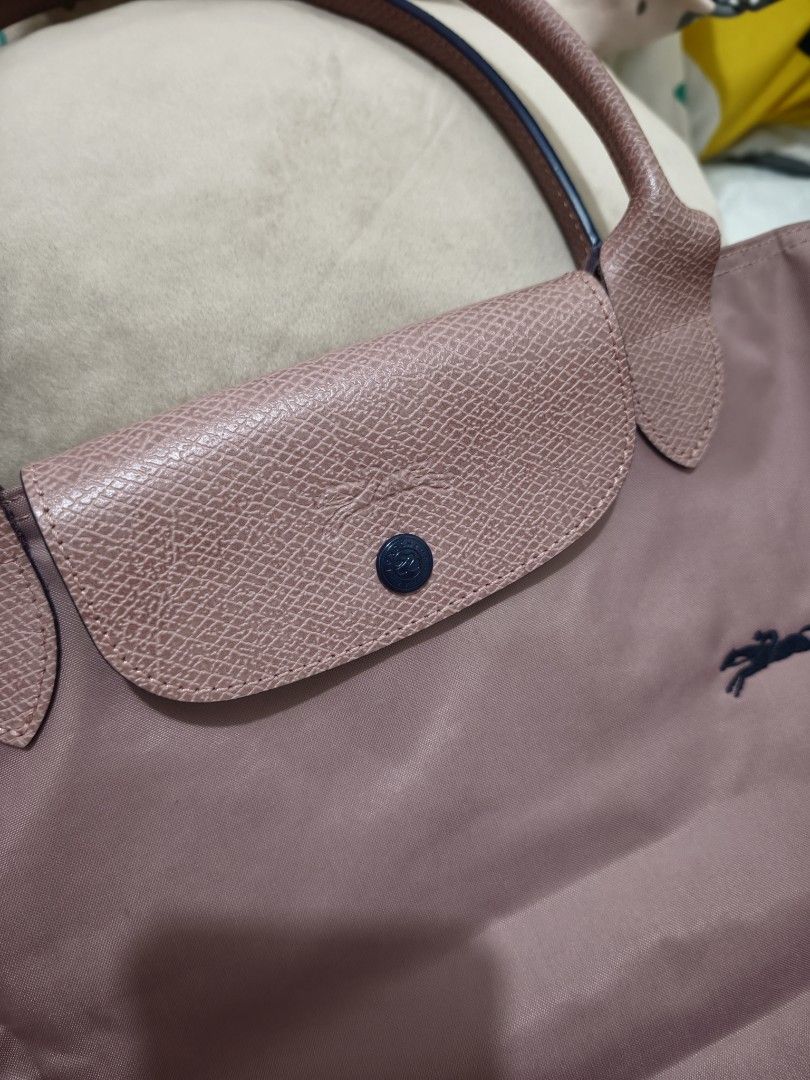 Longchamp Rose Pink Tote Bag (Category: Luxury Bags & Wallets) located in Pasig City. Submitted by purpleglitters (Listing ID 1466261784, Image 3). Description: - Color: Old Rose LLH - Style: Long-handled tote bag - Material: Durable nylon body with leather flap and snap closure - Hardware: Silver-toned top zipper - Interior: Spacious main compartment for daily essentials - Condition: Excellent / Well-maintained - Shipping: Nationwide via courier