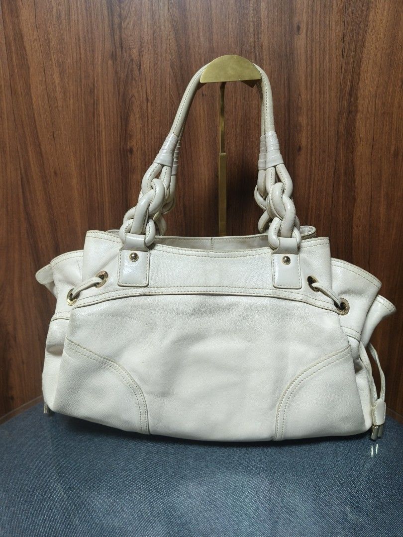 Louis Quatorze Leather Hobo Bag (Category: Tote Bags) located in Baguio. Submitted by PreiLoveMaria (Listing ID 1466307039, Image 3). Description: Louis Quatorze Leather Hobo / Shoulder Bag Crafted from premium genuine leather in a classic cream color, featuring a sophisticated debossed monogram logo on the front, stylish braided handle details, and chic side-drawstring accents. Elegant gold-tone hardware featuring custom-engraved Louis Quatorze 