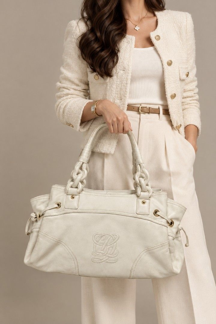 Louis Quatorze Leather Hobo Bag (Category: Tote Bags) located in Baguio. Submitted by PreiLoveMaria (Listing ID 1466307039, Image 1). Description: Louis Quatorze Leather Hobo / Shoulder Bag Crafted from premium genuine leather in a classic cream color, featuring a sophisticated debossed monogram logo on the front, stylish braided handle details, and chic side-drawstring accents. Elegant gold-tone hardware featuring custom-engraved Louis Quatorze 