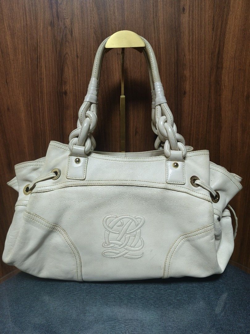 Louis Quatorze Leather Hobo Bag (Category: Tote Bags) located in Baguio. Submitted by PreiLoveMaria (Listing ID 1466307039, Image 2). Description: Louis Quatorze Leather Hobo / Shoulder Bag Crafted from premium genuine leather in a classic cream color, featuring a sophisticated debossed monogram logo on the front, stylish braided handle details, and chic side-drawstring accents. Elegant gold-tone hardware featuring custom-engraved Louis Quatorze 