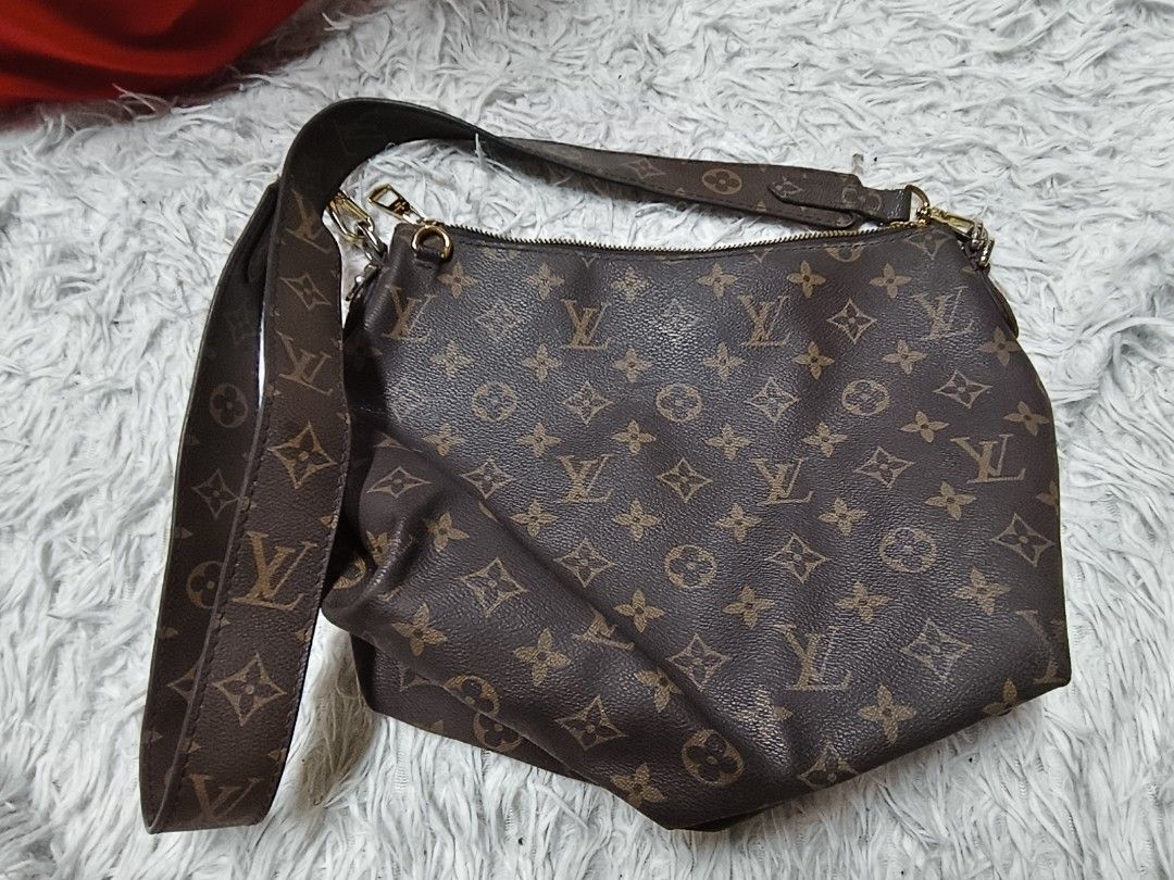 Louis Vuitton Monogram Canvas Shoulder Bag (Category: Luxury Bags & Wallets) located in Pasay City. Submitted by cory0223 (Listing ID 1466156017, Image 1). Description: - Brown monogram canvas shoulder bag - Includes monogram strap with gold-toned hardware - Burgundy interior lining with zip top closure - Blue leather brand tag with date code MI3119 - Spacious enough for daily essentials.